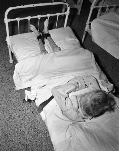 woman tied to bed