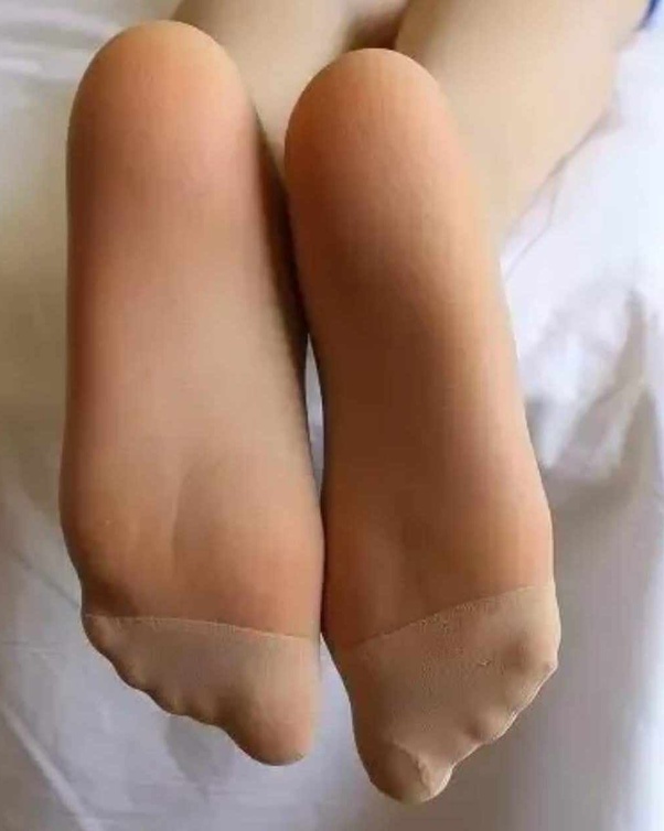 pantyhose feet in face